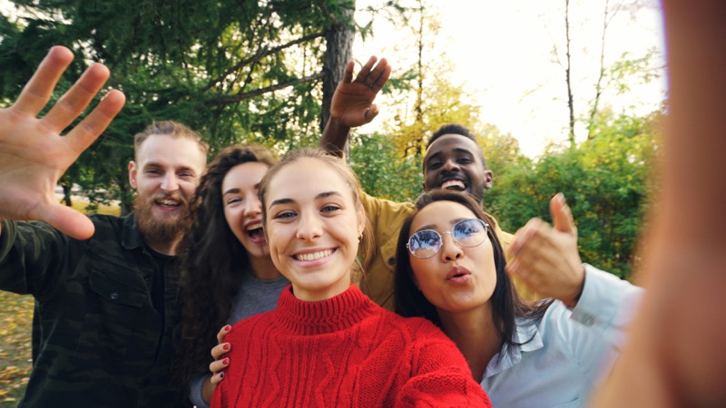 A diverse group of friends in a park